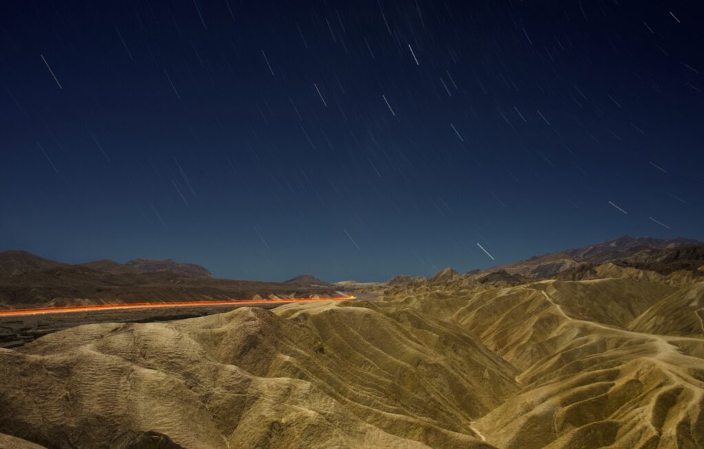 death-valley-car-lights-star-trails-night-photo-edit